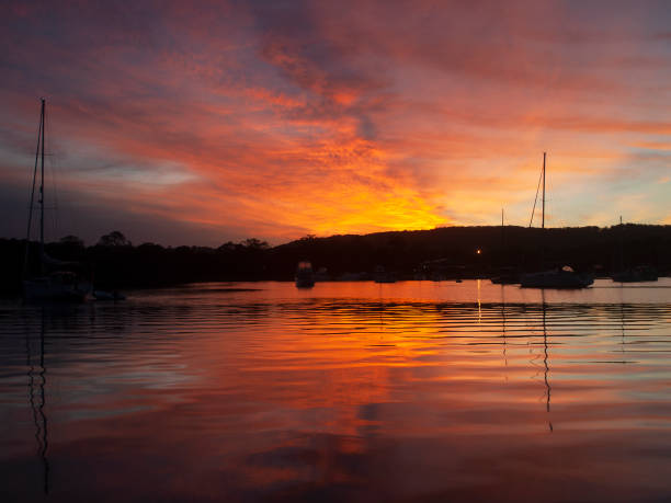 istock Orange-red stratocumulus cloudy Sunrise Seascape. Australia 1154478374