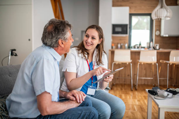 istock Young healthcare worker going through the results with a senior man using a digital tablet 1154482220