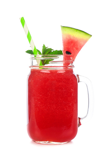 Watermelon juice in a mason jar glass isolated on a white background