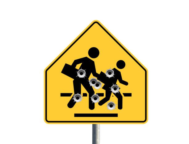 School Shooting Concept with crossing sign with bullet holes