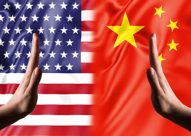 istock HAND STOP SIGNS with USA and Chinese flags / War concept (Click for more) 1154490522