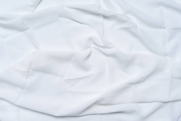 istock White wrinkled, rippled, surface fabric texture background. 1154502460
