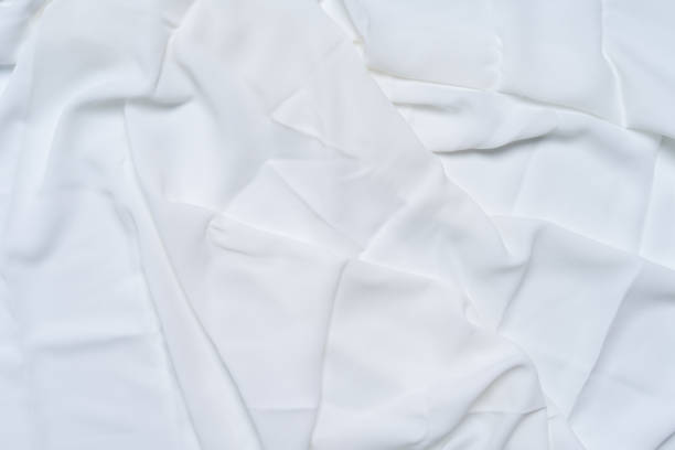 istock White wrinkled, rippled, surface fabric texture background. 1154502491