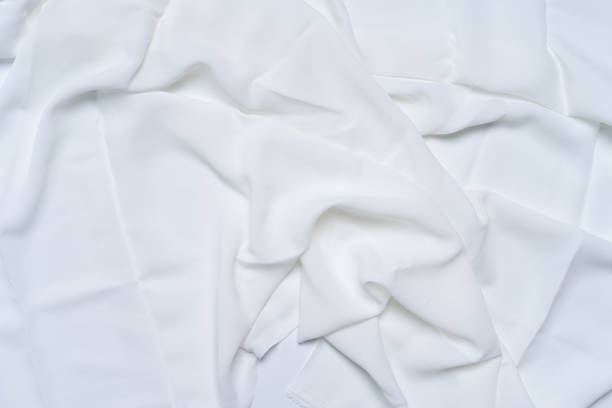istock White wrinkled, rippled, surface fabric texture background. 1154502504
