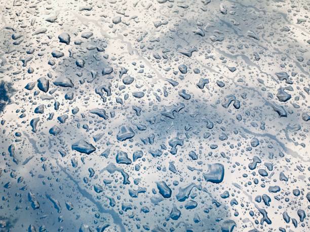 istock close up abstract background image of rain drops on car exterior 1154504695