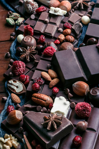 istock Assorted chocolate, nuts and dried fruit in old fashioned style 1154509542