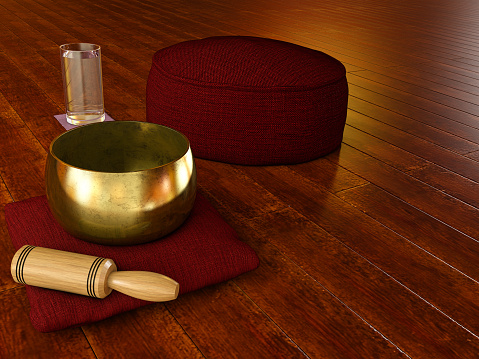 Meditation environment with wooden floor, Tibetan singing bowl, glass of water and Cushion Zafu Yoga Meditation - 3D illustration