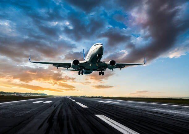 istock Passenger airplane landing at dusk 1154520304