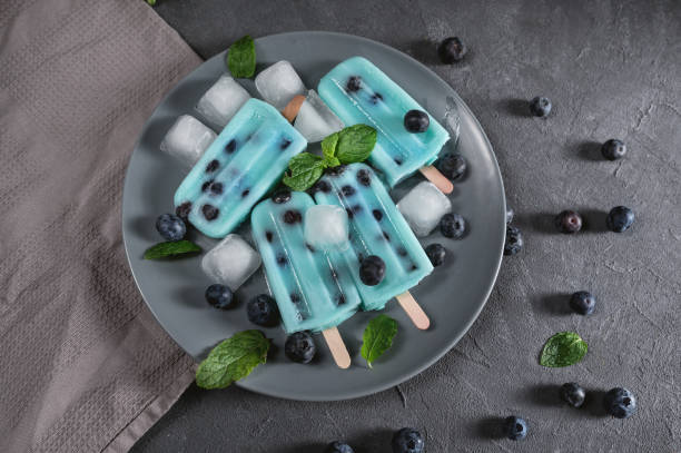 Blue popsicles with blueberries