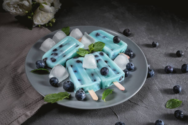 Blue popsicles with blueberries