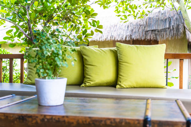istock Vase plant on table decoration with pillow on sofa chair 1154526761