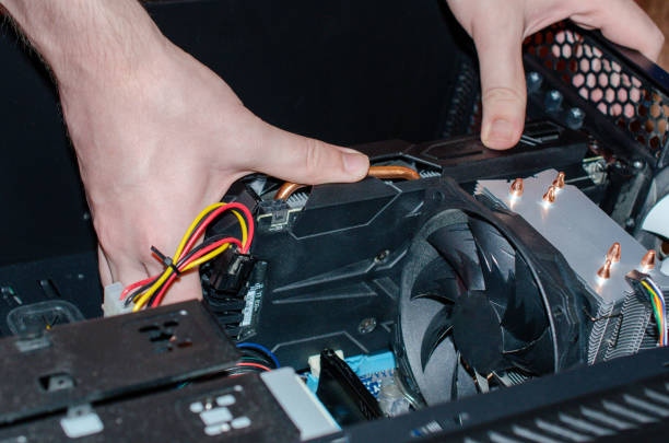 istock the insides of a computer in the hands of a technician 1154527994
