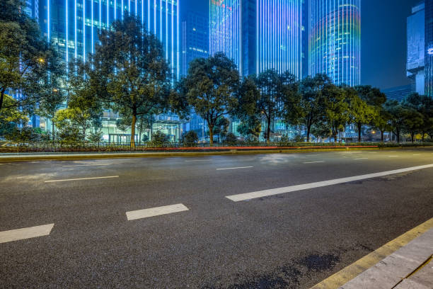 istock Empty asphalt road through modern city in Shanghai, China 1154530595