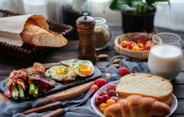 homemade healthy breakfast: toasted bread, fried egg,bacon and asparagus