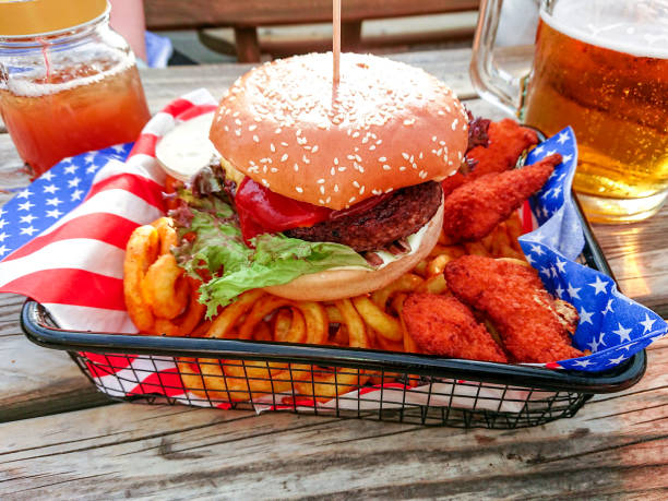istock Hamburger with nuggets on twisted french fries 1154534102