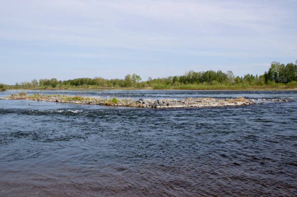 istock stone island on the river with a fast current 1154534438