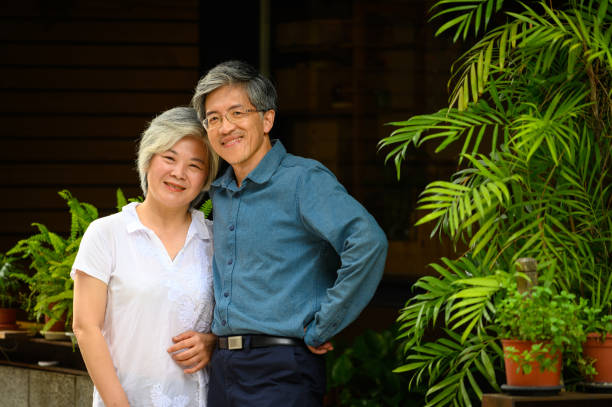 istock Smiling owners standing against restaurant in city 1154535129