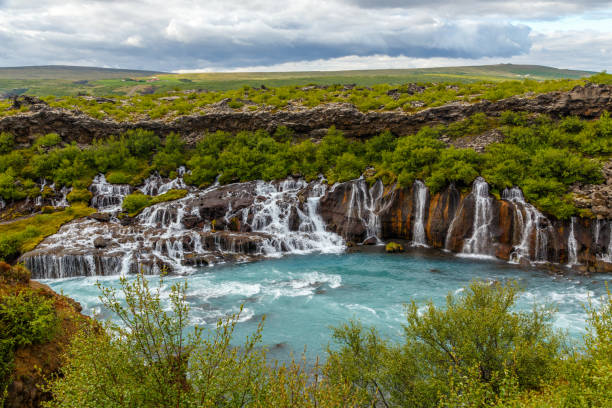 istock Hraunfossar waterfall powerful streams falling into Hvita river turquoise waters, Husafell, Western Iceland 1154537485