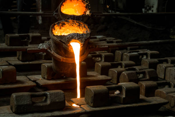 istock metal casting process with red high temperature fire in metal part factory 1154540415