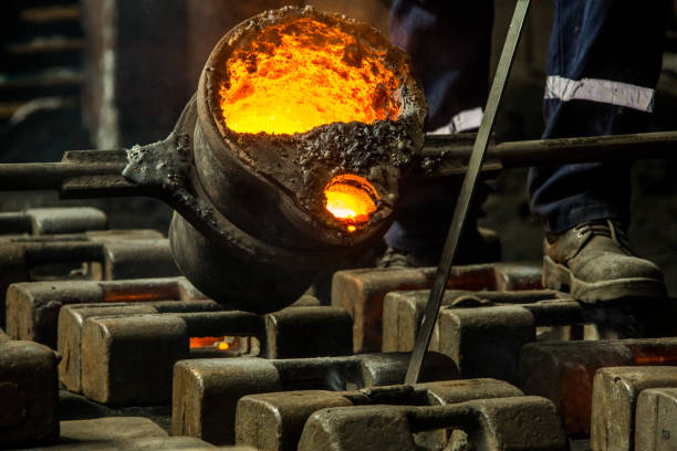 istock metal casting process with red high temperature fire in metal part factory 1154540421