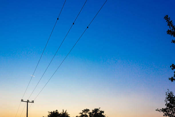 istock telegraph pole at colorful sunset 1154540488