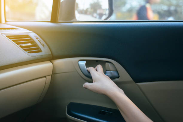 istock Hands open door car and  lock door control panel of auto button glass controlling window in the car 1154540538