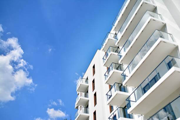 istock Modern apartment buildings on a sunny day with a blue sky. 1154542353