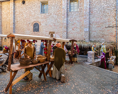 Life-size statues recreate the atmosphere of a medieval village in the historic centre of Corciano during the Christmas celebrations. The town is located in Umbria, central Italy.