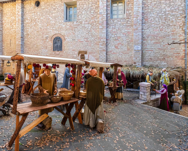 Christmas in Corciano, Italy Life-size statues recreate the atmosphere of a medieval village in the historic centre of Corciano during the Christmas celebrations. The town is located in Umbria, central Italy. market square stock pictures, royalty-free photos & images