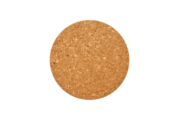 Empty round cork coaster, isolated on white background. Top view image.