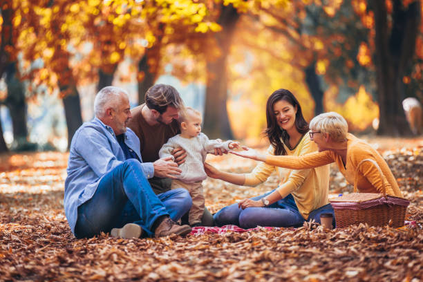 istock Multl generation family in autumn park having fun 1154545617