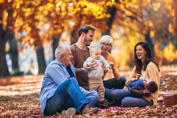istock Multl generation family in autumn park having fun 1154548374