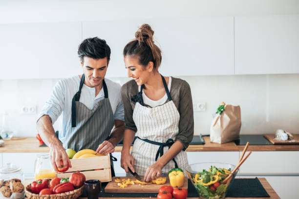 istock Young couple cooking healthy 1154551126