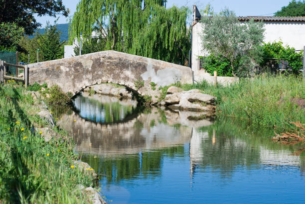 Bridge of a little village of Spain. Water channel.