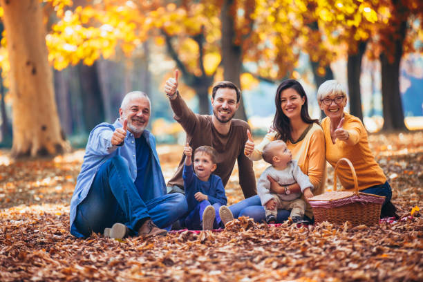 istock Multl generation family in autumn park having fun 1154554816