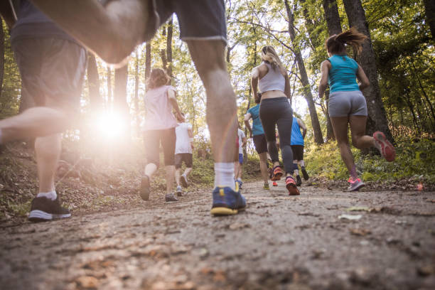 istock Below view of marathon runners racing through nature. 1154556736