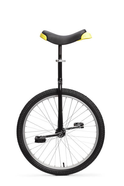студийный снимок одноколесного велосипеда - unicycle стоковые фото и изображения