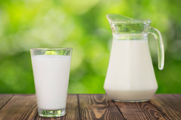 istock milk in glass and jug on table 1154562830