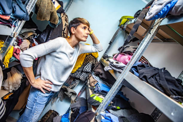 istock Confused Mother Searching for Clothes. 1154563852