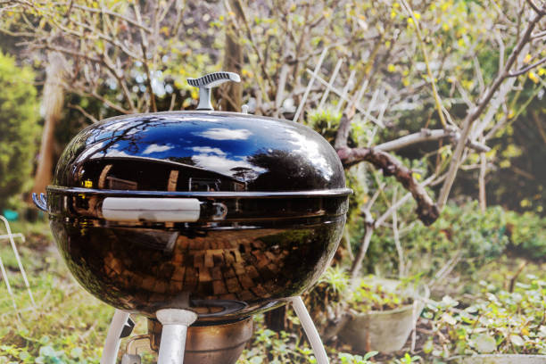 Kettle-style barbecue outdoors in a garden