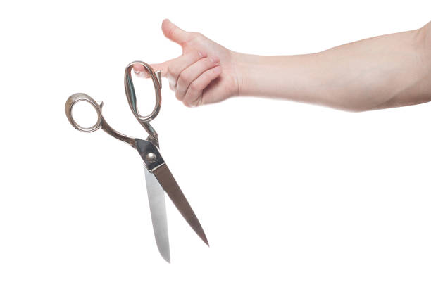 istock Hand holding big steel scissors, industrial tool, isolated on white background 1154567844