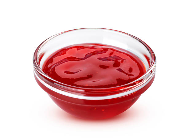 istock Red berry jam isolated on white background 1154567845