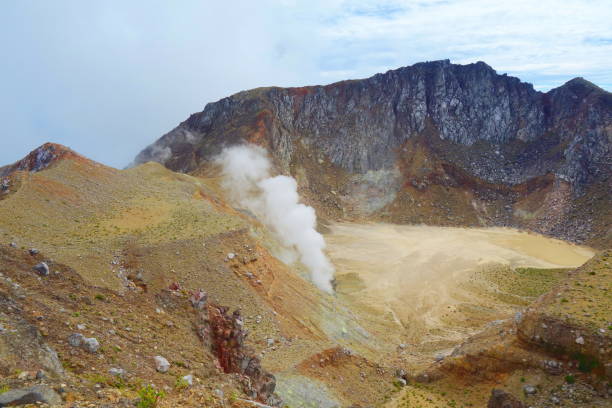 istock Active volcano Mount Egon with a caldera and sulfuric gasses coming from within the volcano on East Nusa Tenggara, Flores, Indonesia 1154570451