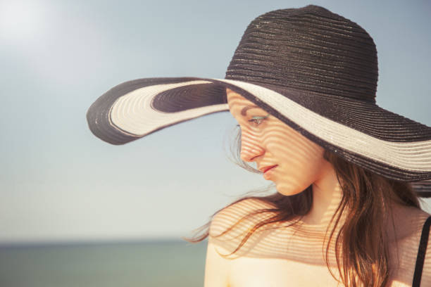 istock woman in hat 1154570641