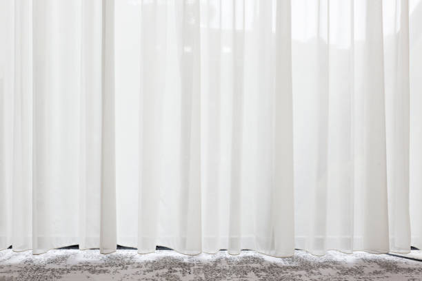 Long, white, semy see-through curtain hanging in the window Long, white, semy see-through curtains hanging in the window classic curtains stock pictures, royalty-free photos & images