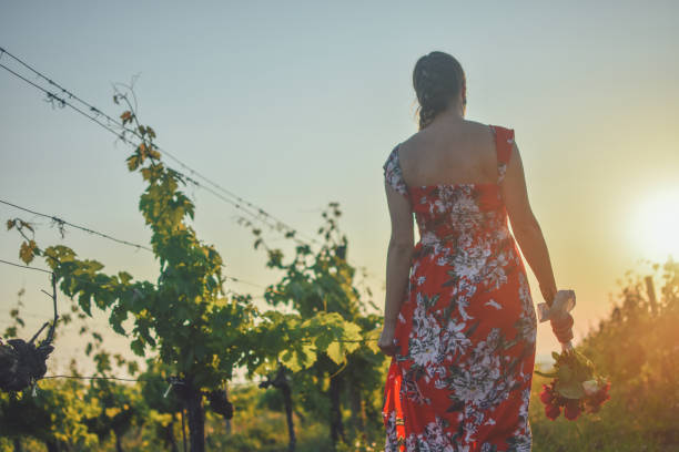 istock Happy woman in vineyard 1154573717