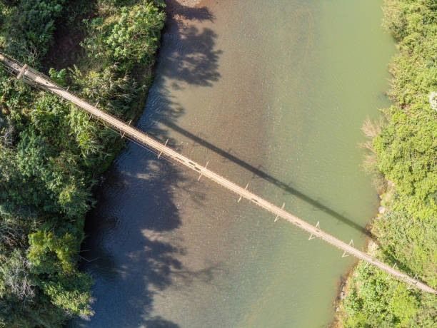 istock Iron and wood small bridge over a river 1154578903