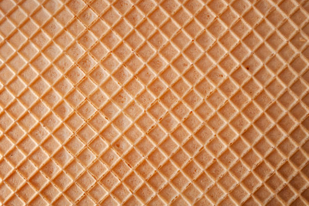 dessert-konzept mit vollbild-makro hautnah auf der detailstruktur eines wafers mit copyspace - waffle stock-fotos und bilder