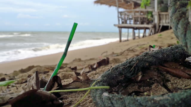 Single use plastic ocean pollution discarded drinking straw