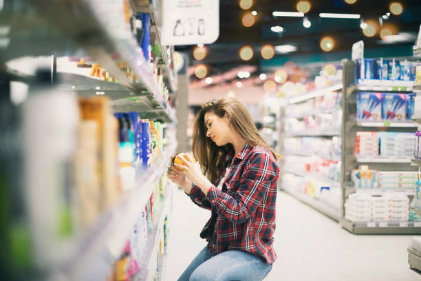 istock Woman choosing sunscreen lotion 1154583394